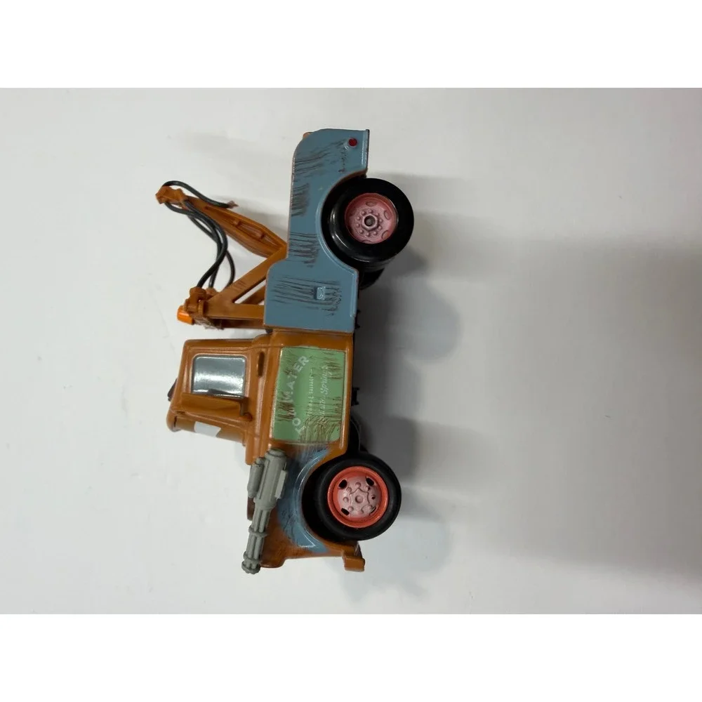 Disney Pixar Cars 2 Spy Mater Tow Truck with Gatling Guns Brown Toy Vehicle